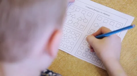 Children draw and write the letters in the notebook perform tasks Video stock 55571828