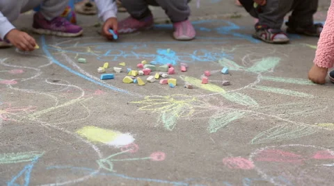 Children draw with chalk on the asphalt Stock Footage 63789334