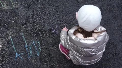 Children draw with chalk on asphalt Video stock 273611844