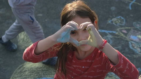Children draw with chalk on asyalte. Selective focus. Stock Footage 187557089