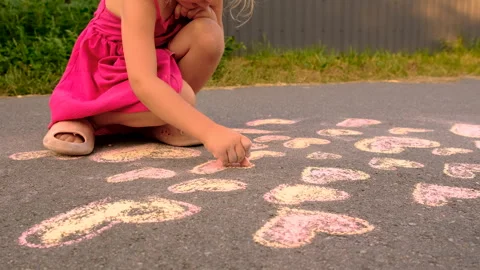 Children draw with chalk on the pavement. Selective focus. Stock Footage 294884112