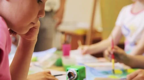 Children draw with crayons and paints Stock Footage 54939451