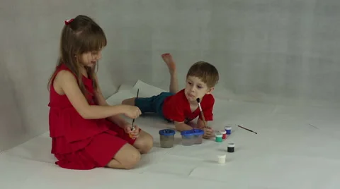 Children draw on paper with brushes and gouache Stock Footage 60643586