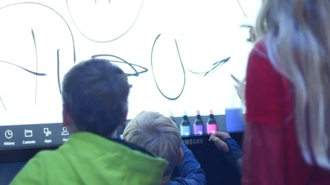 Children draw on the touchscreen Stock Footage 87134777