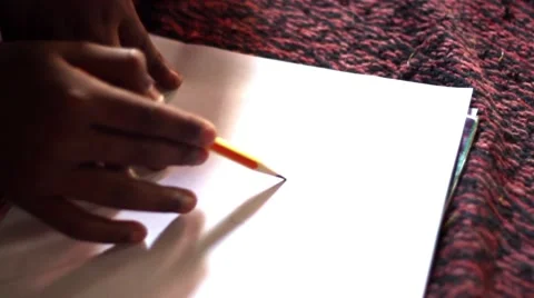 Children drawing hands closeup pan and tilt to faces Stock Footage 49908568