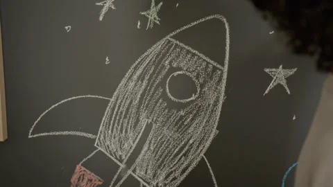 Children Drawing Space Rocket with Chalk on Chalkboard Wall Stock Footage 342502118