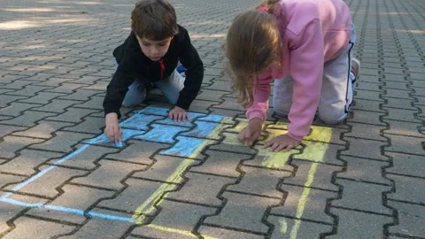 Children Draws With Chalk on Pavement Drawing of Big Ukrainian Flag. Little.. Video stock 331267916