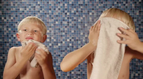 Children drying faces with towel Video stock 32651621