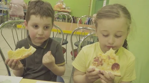 Children eat pizza Stock Footage 79914696
