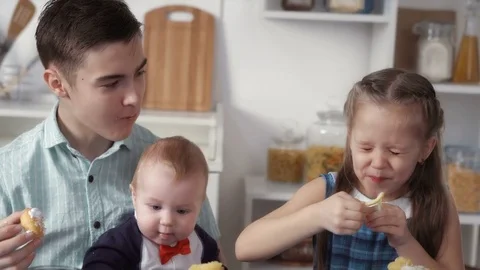 Children eat sweets Stock Footage 73096252