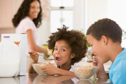 Children eating breakfast Stock Photos