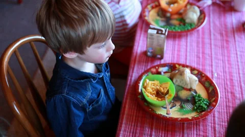 Children eating macaroni dinner Stock Footage 32905986