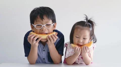 Children eating melon Stock Footage 56622613