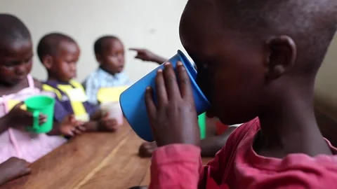 Children eating at the orphanage in Uganda Stock Footage 148747153