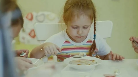 A children eats at the table at home Stock Footage 83151139