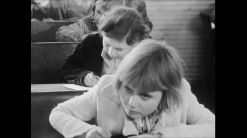 Children In Elementary School Classroom Writing On Paper Stock Footage 113298748