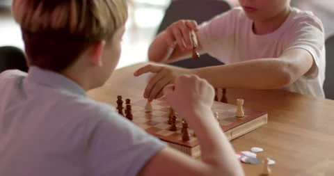 Children Engaging in Chess at School Competitions. Teenagers Brain development. Stock Footage 248099312