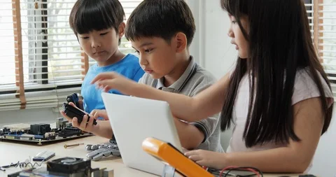 Children engineer team working  Assembling and Testing to equipment in workshop. Stock Footage 108720710