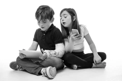 Children engrossed in technology Foto stock