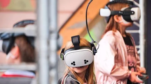 Children experiencing virtual reality, learning and gaming with new technology Stock Photos