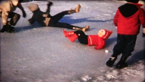 Children fall down on ice in the backyard pool 1950s vintage home movie 5589 Stock Footage 119608715