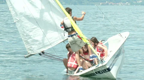 Children falling in the water while practicing sailing Stock Footage 36783955