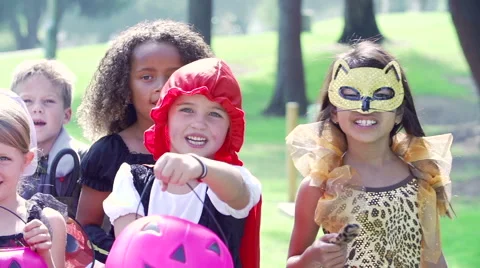 Children In Fancy Costume Dress Going Trick Or Treating Stock Footage