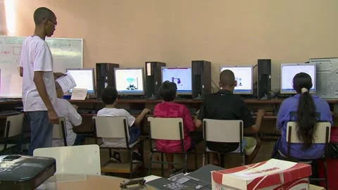 Children in the favela learn to use computers at the local school Stock Footage 151945105