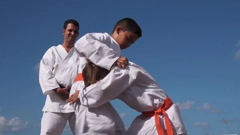 Children Fighting At Karate School And Teacher Looking At Them Stock Footage