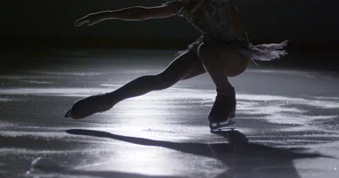 Children figure skating on ice slow motion Stock Footage