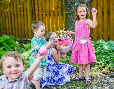 Children finding eggs on an easter egg hunt Stock Photos