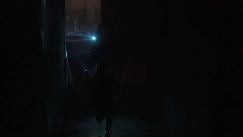 Children with flashlights running in slow motion through dark tunnels Stock Footage 195764560