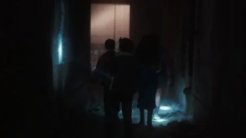 Children with flashlights walking through dark tunnels Stock Footage 195764513