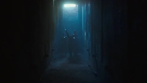 Children with flashlights walking through dark tunnels Stock Footage 195764661
