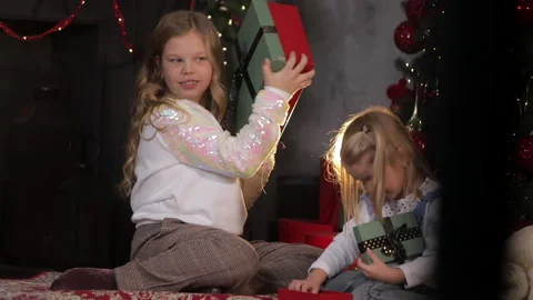 Children found a gift under the Christmas tree Stock Footage 145366294