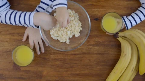 Children with fruit chips and orange juice Stock Footage 102274176