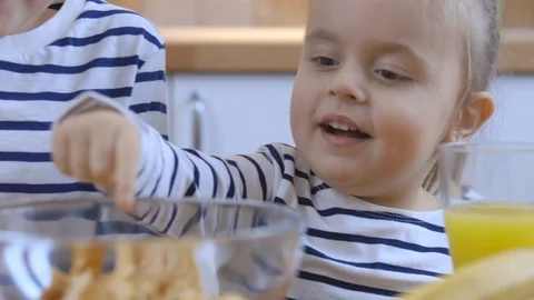 Children with fruit chips and orange juice Stock Footage 102298106
