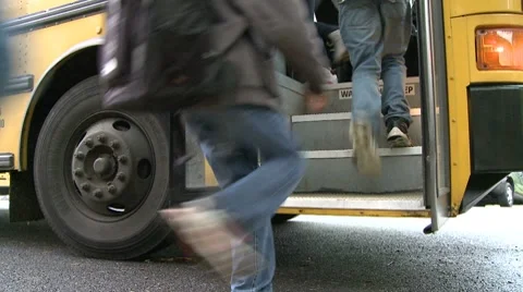 Children get on bus (1 of 3) Stock Footage 8699312