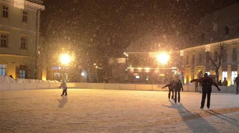Children give skates on a ice lake in downtown arranged bright yellow 01 Stock Footage 59556251