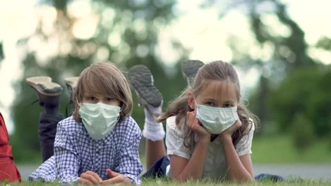 Children go back to school. Cute pupils with backpacks. Boy and girl in safety Stock Footage 136354853