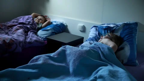 Children going to bed in a mobile home on family vacation Stock Footage 312468506