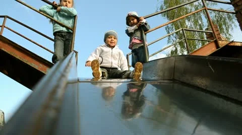 Children going down slide Stock Footage 10952739
