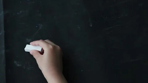 Children is hand writes an example in chalk Stock Footage 134547359