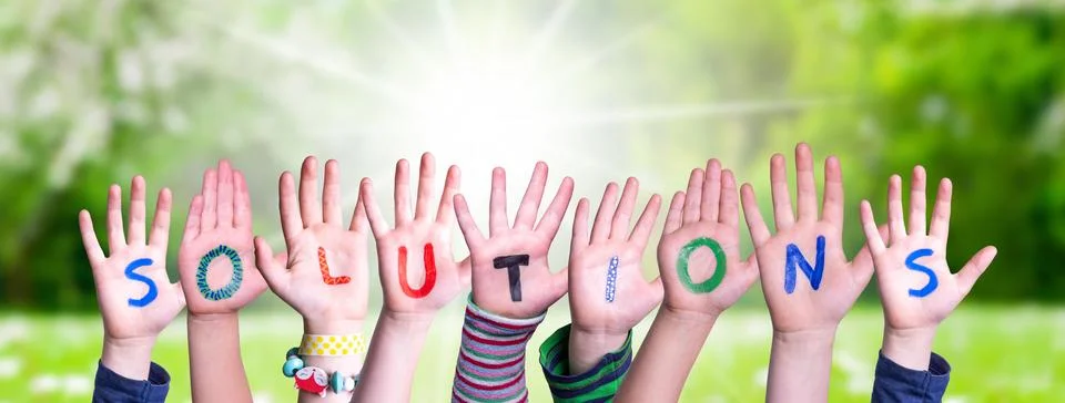 Children Hands Building Word Solutions, Grass Meadow Stock Photos