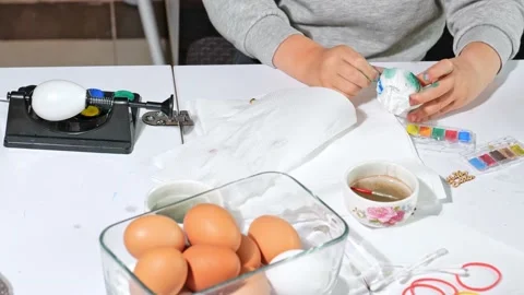 Children hands painting Easter eggs Stock Footage 163982392