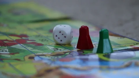 Children hands playing board game on a floor Stock Footage