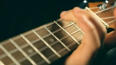 Children Hands trains learning to play the Ukulele Stock Footage 123914116
