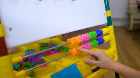 Children hands using abacus to learn numbers and account at home Stock Footage 135711153