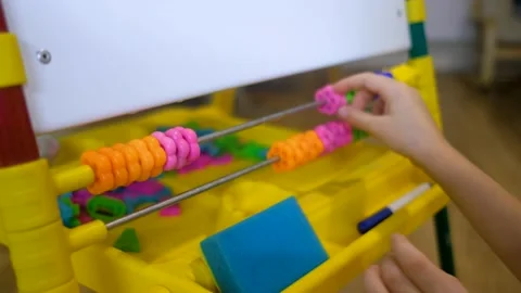 Children hands using abacus to learn numbers and account at home Stock Footage 145633198