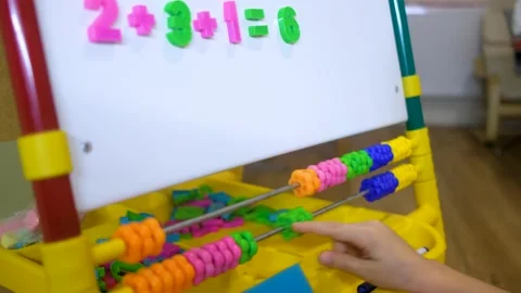 Children hands using abacus to learn numbers and account at home Stock Footage 163694630